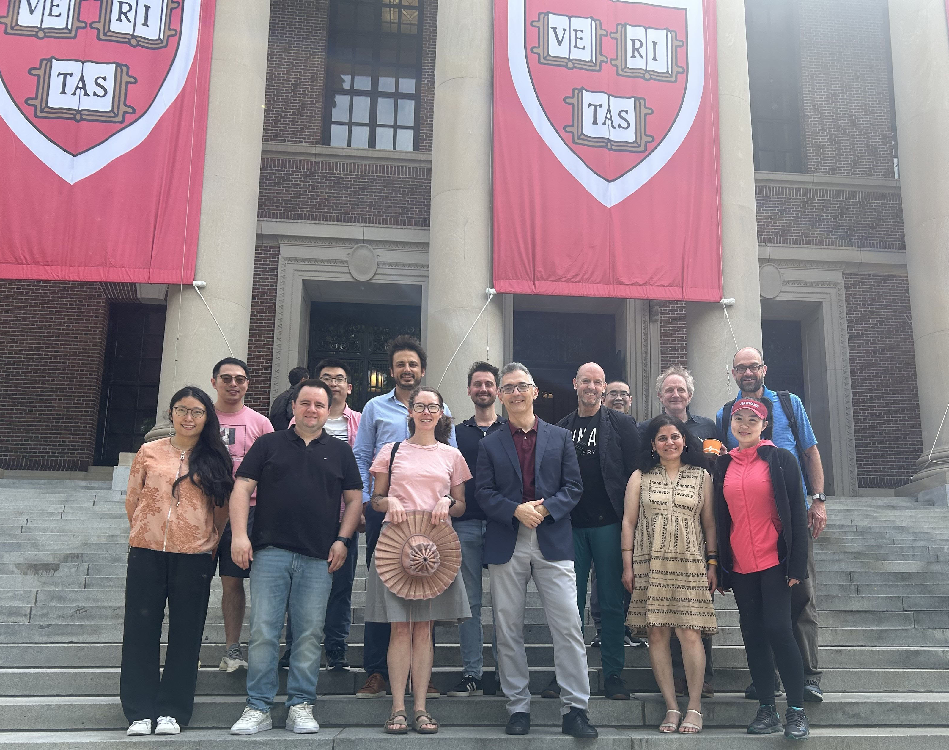 An image of CGA members and friends on the steps of Widener Library, Harvard University.