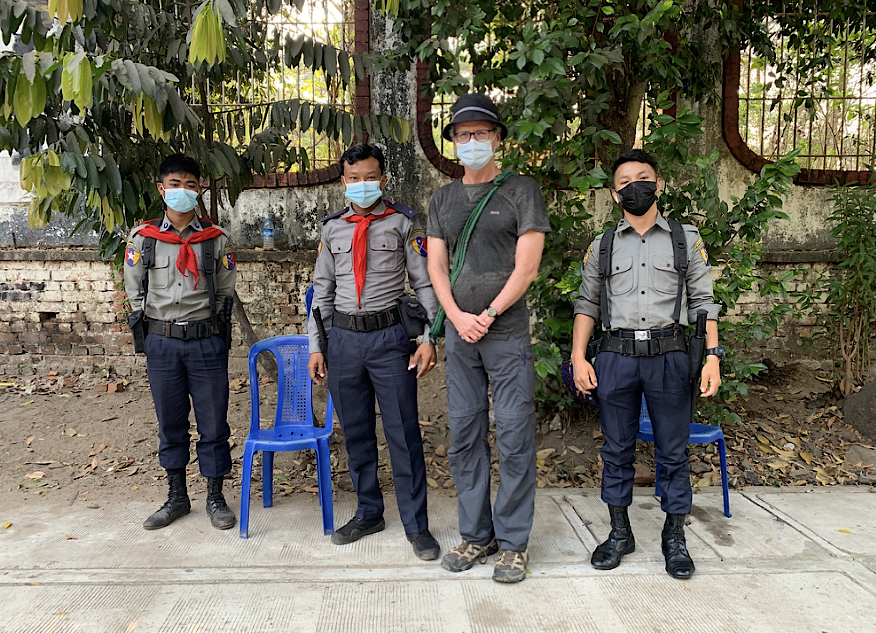 An image of Paul Salopek with security in Myanmar.