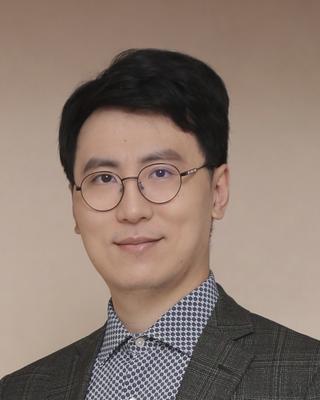 Head shot photo of Dr. Wang.